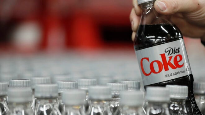SALT LAKE CITY, UT - FEBRUARY 10: A bottle of Diet Coke is pulled for a quality control test at a Coco-Cola bottling plant on February 10, 2017 in