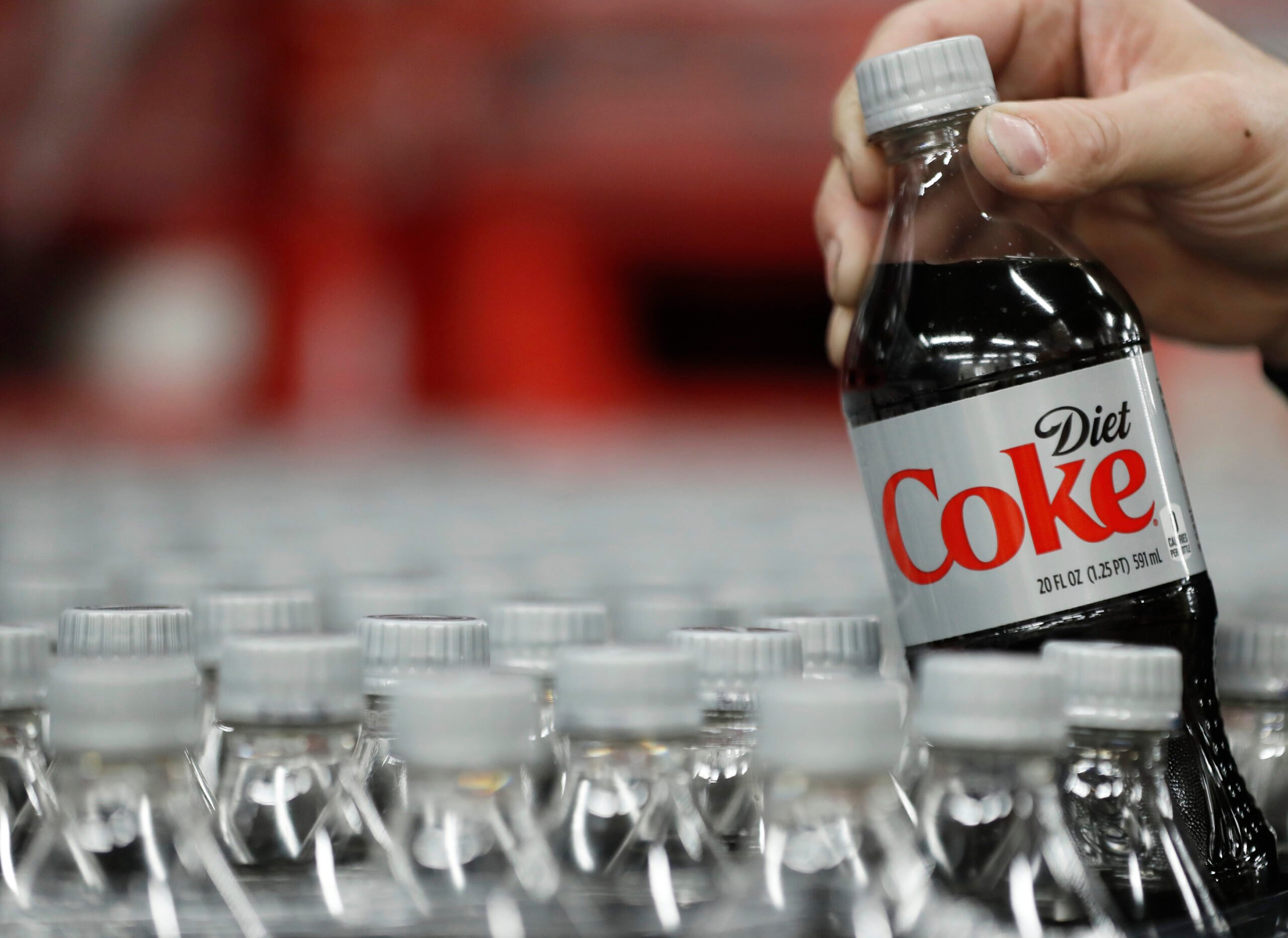 SALT LAKE CITY, UT - FEBRUARY 10: A bottle of Diet Coke is pulled for a quality control test at a Coco-Cola bottling plant on February 10, 2017 in