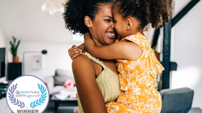 mom carrying toddler or preschool age daughter