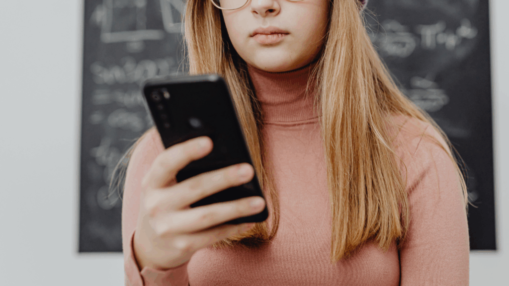 young woman looking at phone
