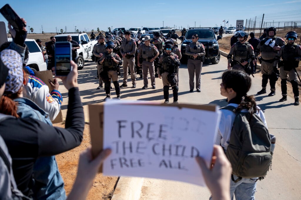 Texas State Troopers prepare to disperse a crowd protesting Immigration and Customs Enforcement outside the South Texas Family Residential Center on January 28, 2026 in Dilley, Texas.