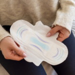 woman holding maxi pad