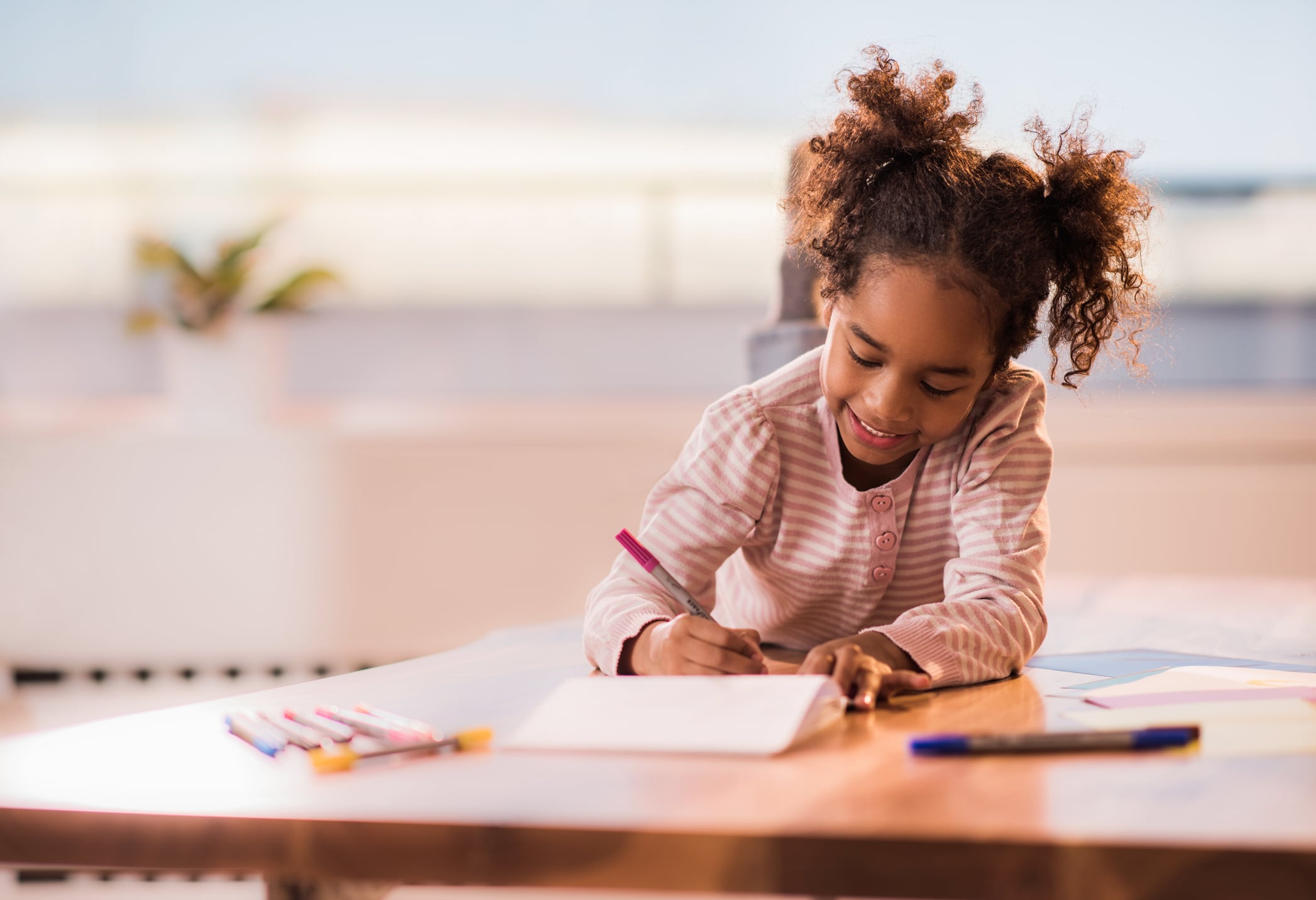 girl drawing in notebook